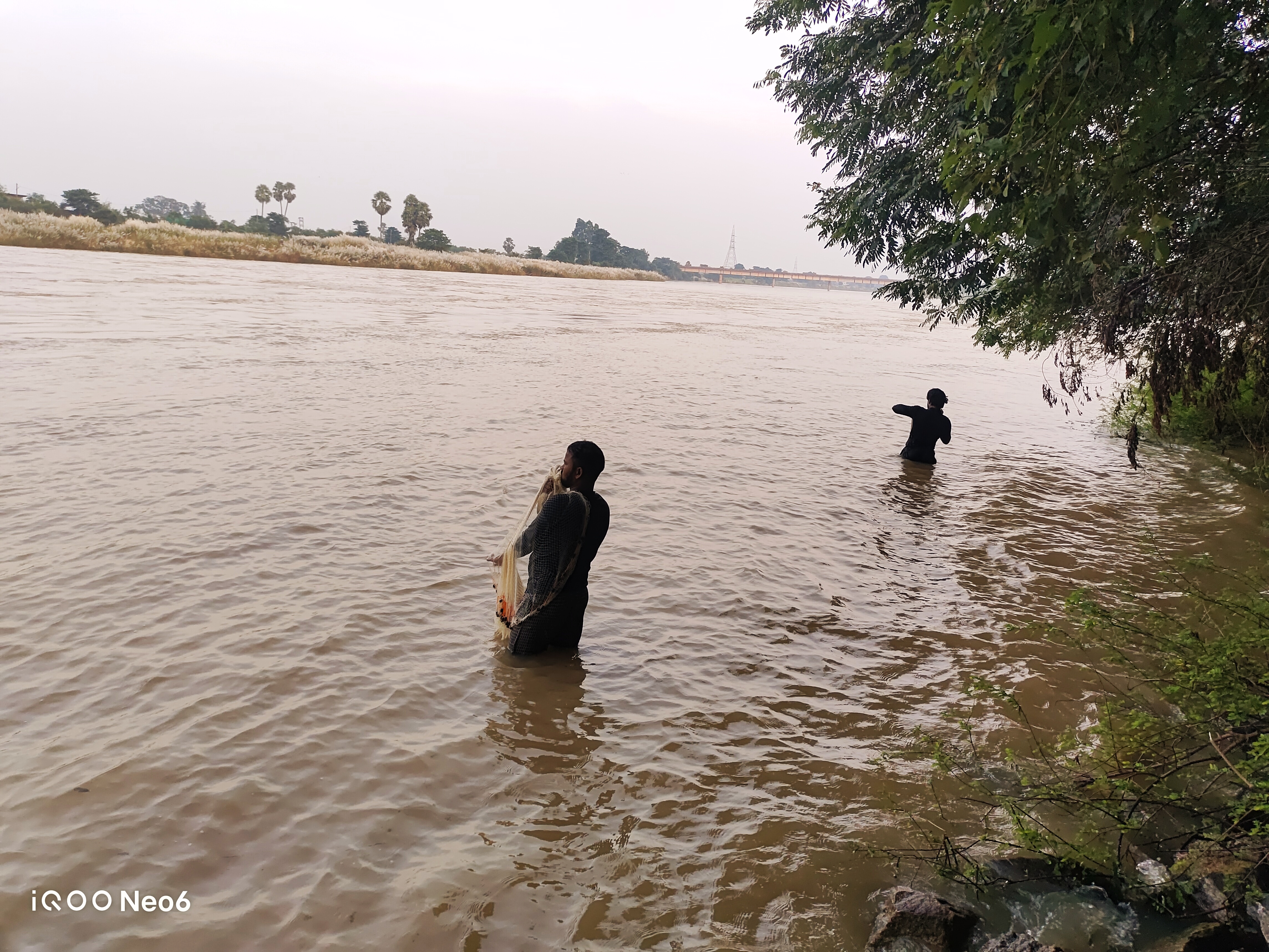 Riverside Fishing:Capturing the Art of Patience | ShotOniQOO